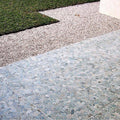 Detail view of flat sliced pebble mosaic in light grey, highlighting the smooth natural stone surface.